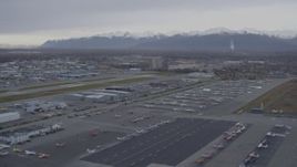 4K aerial stock footage flying low over Merrill Field runways, parked planes, Anchorage, Alaska Aerial Stock Footage | AK0001_0157