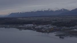 4K aerial stock footage flying by an oil refinery on the shore of Knik Arm of Cook Inlet, Anchorage, Alaska Aerial Stock Footage | AK0001_0164