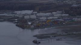 4K aerial stock footage flying by an oil refinery, shore of the Knik Arm of Cook Inlet, Anchorage, Alaska Aerial Stock Footage | AK0001_0165