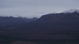 4K aerial stock footage approaching snow capped Chugach Mountains, Alaska Aerial Stock Footage | AK0001_0178