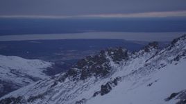 4K aerial stock footage snowy summit, Knik Arm of the Cook Inlet, Chugach Mountains, Alaska, twilight Aerial Stock Footage | AK0001_0189