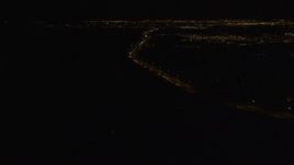 4K aerial stock footage following Glenn Highway, winding toward Anchorage, Alaska, night Aerial Stock Footage | AK0001_0204