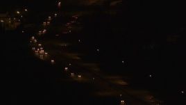 4K aerial stock footage tilting up from Glenn Highway, Anchorage, Alaska, night Aerial Stock Footage | AK0001_0206