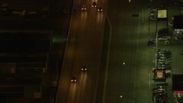 4K aerial stock footage following East 5th Avenue, tracking a police car, Anchorage, Alaska, night Aerial Stock Footage | AK0001_0207