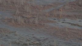 4K aerial stock footage approaching four-wheelers riding through the valley, Knik River Valley, Alaska Aerial Stock Footage | AK0001_0214