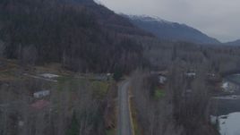 4K aerial stock footage following Old Glenn Highway, approaching Chugach Mountains, Knik River, Alaska Aerial Stock Footage | AK0001_0218