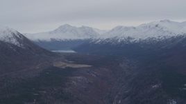 4K aerial stock footage flying by Eklutna Lake, bordered by the Chugach Mountains, Alaska Aerial Stock Footage | AK0001_0227