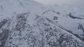 4K aerial stock footage flying over snow covered slopes, Chugach Mountains, Alaska Aerial Stock Footage | AK0001_0229