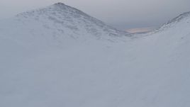 4K aerial stock footage ascend snowy peak, reveal snow capped mountains, Chugach Mountains, Alaska Aerial Stock Footage | AK0001_0231