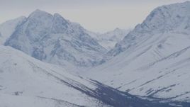 4K aerial stock footage flying by snow covered peaks, Chugach Mountains, Alaska Aerial Stock Footage | AK0001_0232