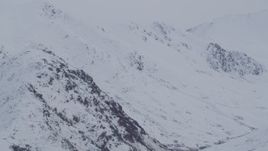 4K aerial stock footage flyby by snow covered peaks, Chugach Mountains, Alaska Aerial Stock Footage | AK0001_0234