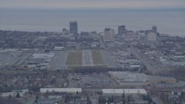 4K aerial stock footage approaching Merrill Field, Downtown buildings, Anchorage, Alaska Aerial Stock Footage | AK0001_0243