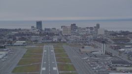 4K aerial stock footage approaching Merrill Field, quick zoom to Downtown buildings, Anchorage, Alaska Aerial Stock Footage | AK0001_0245