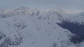 4K aerial stock footage approaching snow covered peaks, deep valley, Chugach Mountains, Alaska Aerial Stock Footage | AK0001_0265