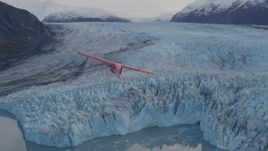 4K aerial stock footage tracking seaplane over a glacier, lake, Inner Lake George, Alaska Aerial Stock Footage | AK0001_0284