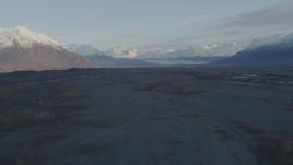 4K aerial stock footage flying over river valley, approaching two parked planes, Knik River Valley, Alaska Aerial Stock Footage | AK0001_0288