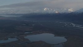 4K aerial stock footage flying by lakes and rivers, bordered by Chugach Mountains, Knik River Valley, Alaska Aerial Stock Footage | AK0001_0297