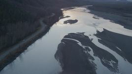 4K aerial stock footage tilting up from the river, Knik River, Alaska, sunset Aerial Stock Footage | AK0001_0304