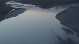 4K aerial stock footage following the Knik River past houses, forest, Knik River, Alaska, twilight Aerial Stock Footage | AK0001_0306