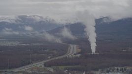 4K aerial stock footage flying by a power plant near Glenn Highway, Anchorage, Alaska Aerial Stock Footage | AK0001_0338