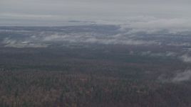 4K aerial stock footage flying by Anchorage with low clouds, Anchorage, Alaska Aerial Stock Footage | AK0001_0343