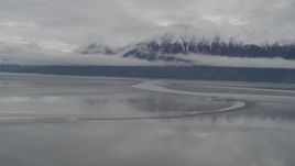 4K aerial stock footage flying by Kenai Mountains, from low over Turnagain Arm of the Cook Inlet, Alaska Aerial Stock Footage | AK0001_0355
