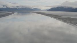 4K aerial stock footage descending toward the glassy water, Turnagain Arm of the Cook Inlet, Alaska Aerial Stock Footage | AK0001_0368