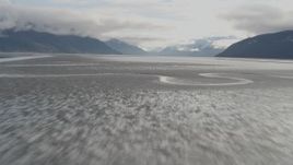 4K aerial stock footage flying low over water, tilt up, revealing Turnagain Arm of the Cook Inlet, Alaska Aerial Stock Footage | AK0001_0372