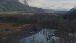 4K aerial stock footage flying low over trees and rivers, revealing small homes, Portage, Alaska Aerial Stock Footage | AK0001_0386