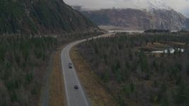 4K aerial stock footage truck on Portage Glacier Highway, tunnel through mountain, Portage Lake, Alaska Aerial Stock Footage | AK0001_0389