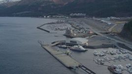 4K aerial stock footage descending low over the bay, near the town, docks, Whittier, Alaska Aerial Stock Footage | AK0001_0396