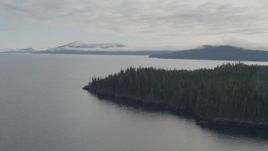 4K aerial stock footage flying out to open water, pan right to shoreline, Passage Canal, Alaska Aerial Stock Footage | AK0001_0407