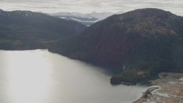 4K aerial stock footage fly over river valley, approaching forested ridge, Prince William Sound, Alaska Aerial Stock Footage | AK0001_0425