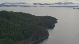 4K aerial stock footage fly over forested shore of the sound, approaching bay, Prince William Sound, Alaska Aerial Stock Footage | AK0001_0428