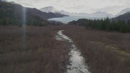 4K aerial stock footage follow river through marshland, approach glacier, Prince William Sound, Alaska Aerial Stock Footage | AK0001_0434