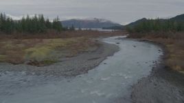 4K aerial stock footage fly low over grassland, near rivers, toward shore, Prince William Sound, Alaska Aerial Stock Footage | AK0001_0455