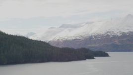 4K aerial stock footage rounding coast, glacier spilling down from mountains, Blackstone Bay, Alaska Aerial Stock Footage | AK0001_0460