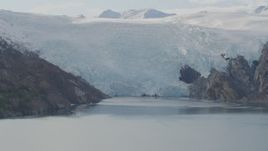 4K aerial stock footage flying by glacier spilling into Blackstone Bay, Alaska Aerial Stock Footage | AK0001_0471