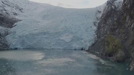 4K aerial stock footage approaching glacier spilling into the bay, zoom in, Blackstone Bay, Alaska Aerial Stock Footage | AK0001_0473