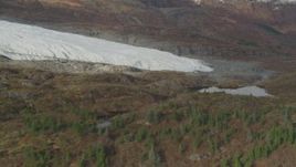 4K aerial stock footage fly by part of glacier on rocky land, near small pond, Blackstone Bay, Alaska Aerial Stock Footage | AK0001_0481