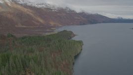 4K aerial stock footage fly over forested shoreline, approach snow capped peaks, Blackstone Bay, Alaska Aerial Stock Footage | AK0001_0482