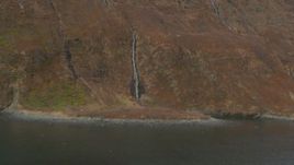4K aerial stock footage small waterfalls pouring down face of Chugach Mountain, Blackstone Bay, Alaska Aerial Stock Footage | AK0001_0486