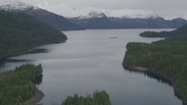 4K aerial stock footage flying over shore, approaching barge, Passage Canal, Shotgun Cove, Alaska Aerial Stock Footage | AK0001_0494