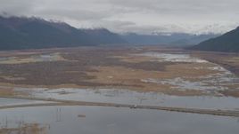 4K aerial stock footage flying by marshland valley beyond train tracks, Portage, Alaska Aerial Stock Footage | AK0001_0519