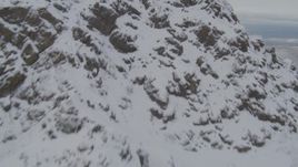 4K aerial stock footage approach snowy peak, Downtown Anchorage, Chugach Mountains, Alaska Aerial Stock Footage | AK0001_0572