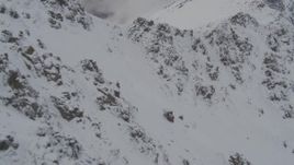 4K aerial stock footage flying low along the rocky slopes and ridges, Chugach Mountains, Alaska Aerial Stock Footage | AK0001_0574