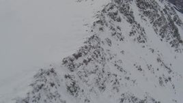 4K aerial stock footage flying low along a rocky ridge, Chugach Mountains, Alaska Aerial Stock Footage | AK0001_0577