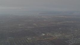 4K aerial stock footage descending through low clouds, revealing Downtown Anchorage, Alaska Aerial Stock Footage | AK0001_0579