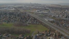 4K aerial stock footage following Glenn Highway, approach Merrill Field and Downtown Anchorage, Alaska Aerial Stock Footage | AK0001_0581