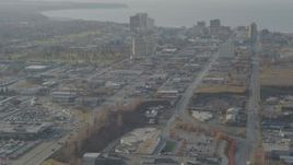 4K aerial stock footage flying by East 5th Avenue, tilt up, revealing Downtown Anchorage, Alaska Aerial Stock Footage | AK0001_0583